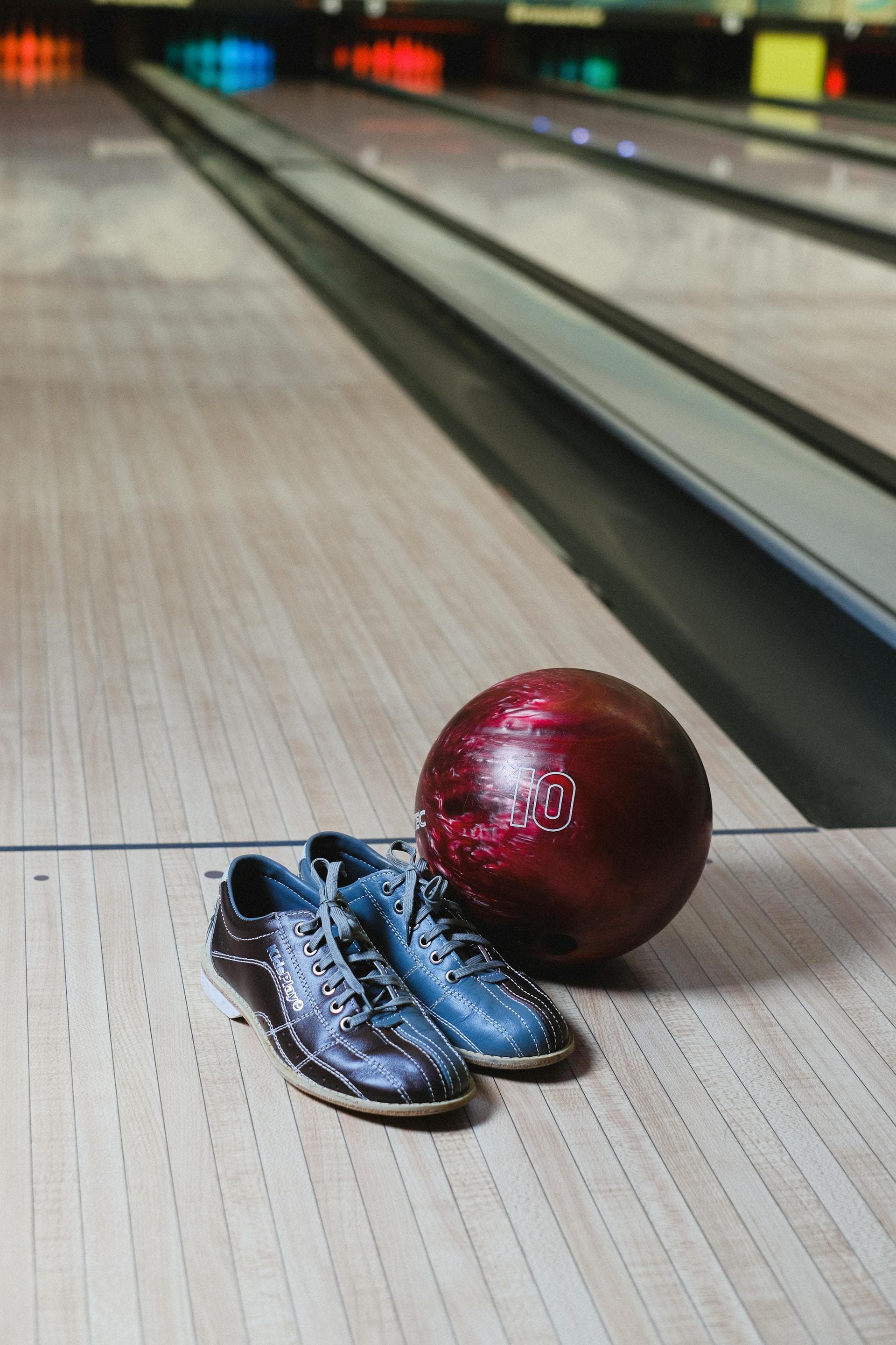 Bowling shoes and ball on the lane